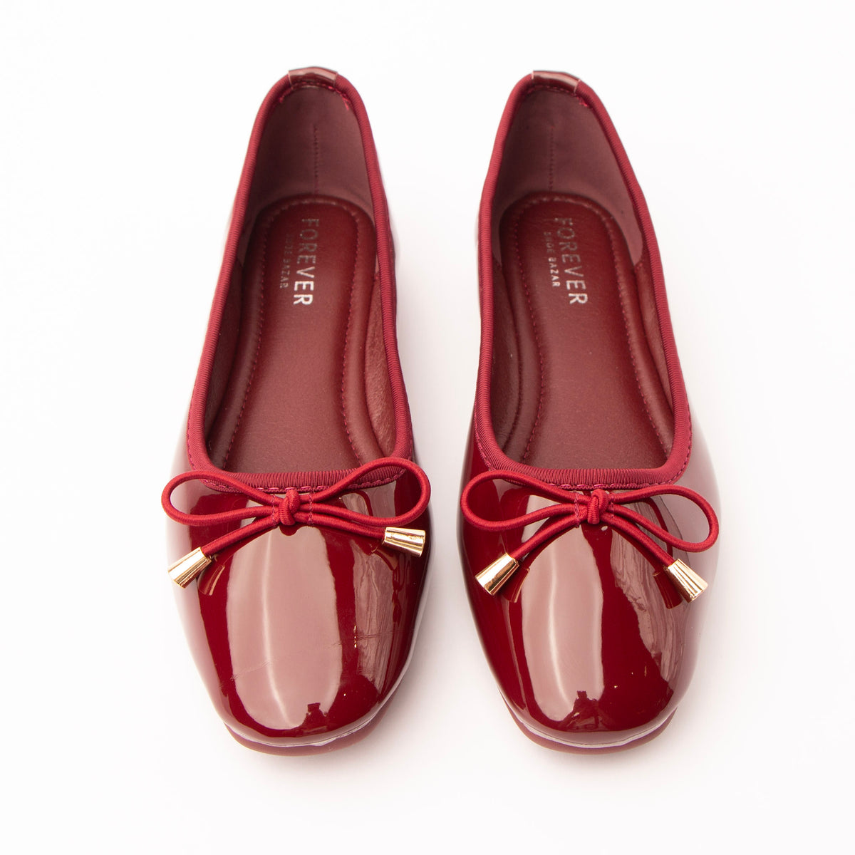 Maroon patent ballerina flats styled for everyday wear