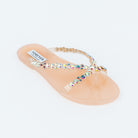 Beige flat sandals styled for casual wear