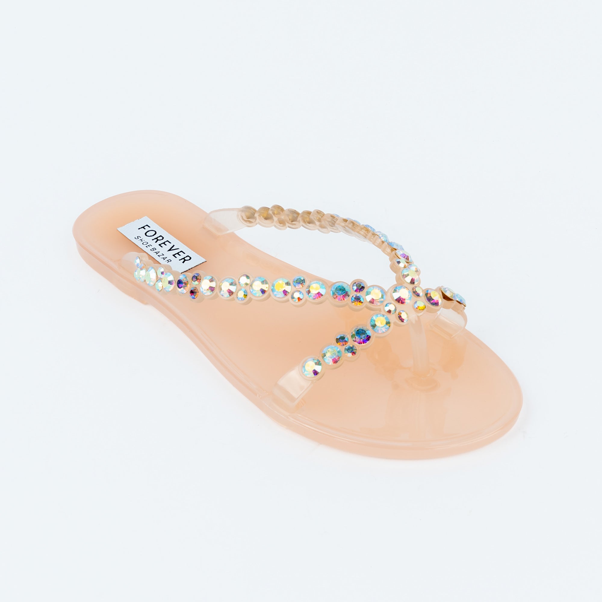 Beige flat sandals styled for casual wear