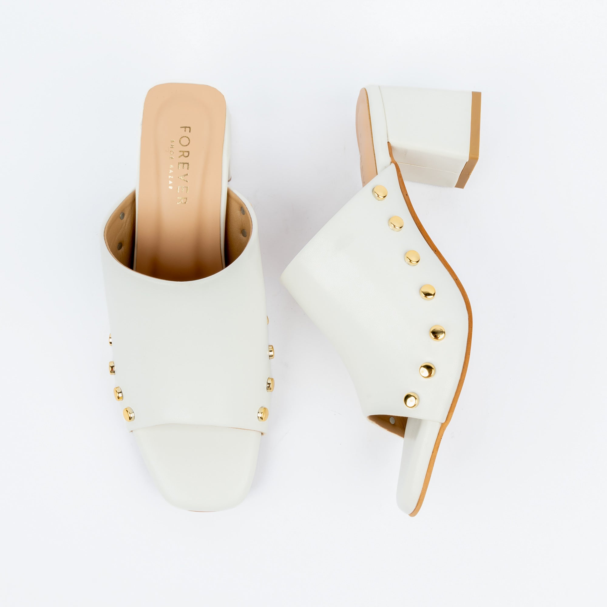 White block heel mules for women, a scalloped vamp edged with a curve of gold dome studs