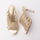 Gold mules for women, both shoes laid flat