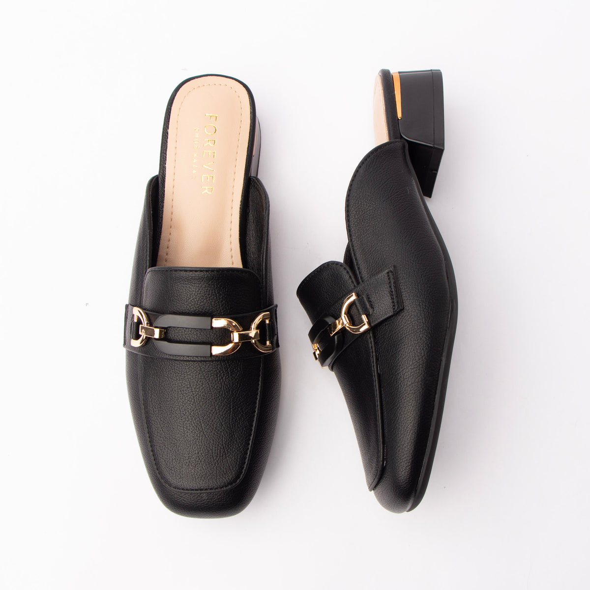 Black horsebit loafer mules for women with a cushioned footbed