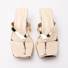 Gold toe-post kitten heel mules for women, both shoes from the front