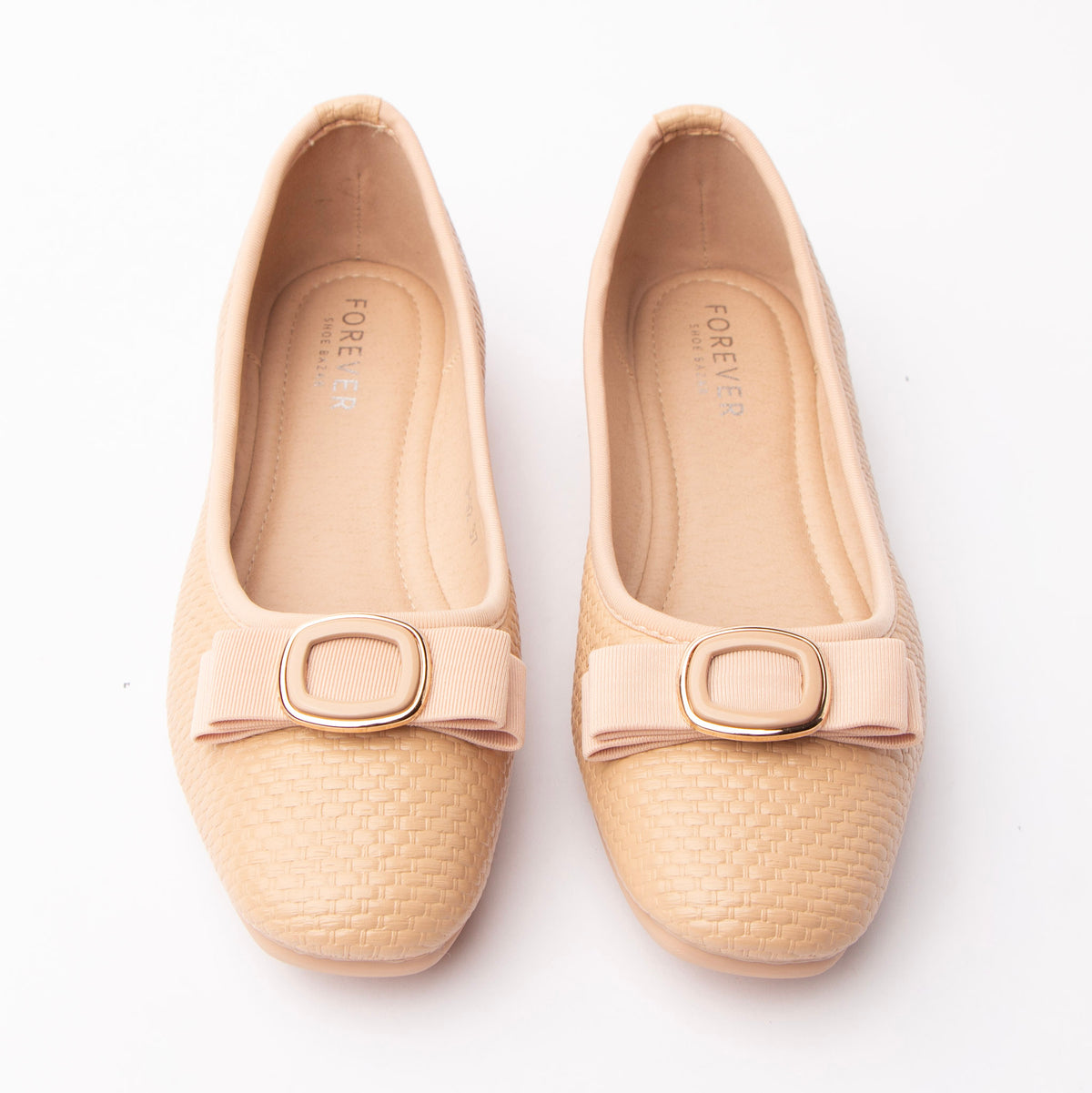 Pink woven ballerina flats styled for everyday wear
