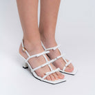 The Tiny Bow Kitten White Open-Toe Heels — side view | Forever Shoe Bazar