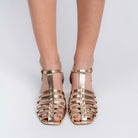 Gold strappy block heels for women showing the sturdy block heel