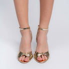 Gold woven strap stilettos for women showing the 10 cm heel