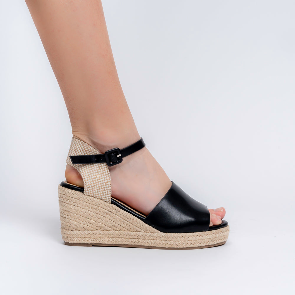 Black woven wedge sandals for women with cushioned footbed and buckle ankle strap