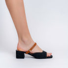 Black denim block heel mules for women styled with jeans