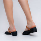 Black denim mules for women — close-up of the denim-textured upper