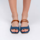 Blue denim mules for women showing the mid-height block heel