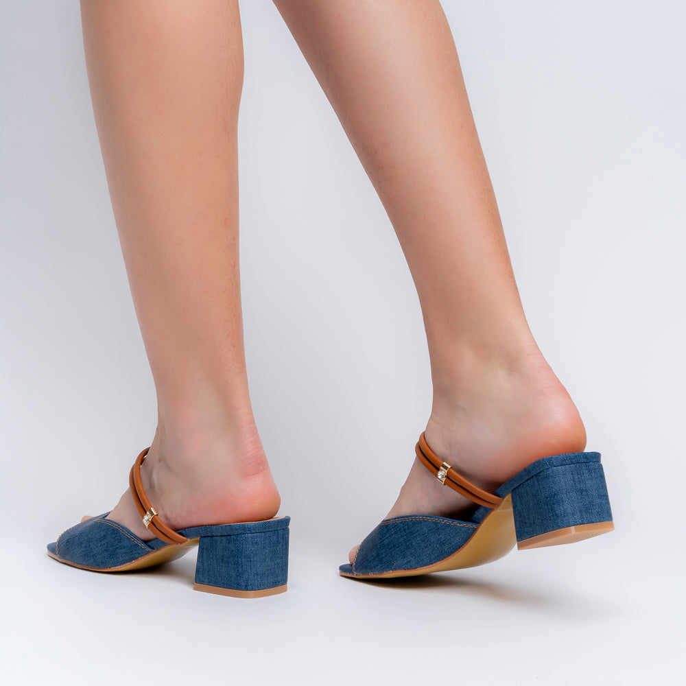 Blue denim mules for women — close-up of the denim-textured upper